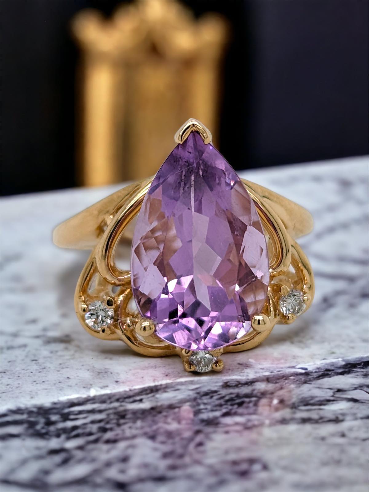 Amethyst pear ring in yellow gold with diamond accents