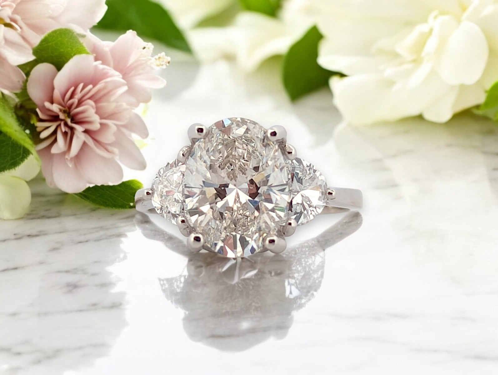 14k white gold engagement ring with 3.02 ctw oval lab diamond center and .80 ctw side stones, IGI VS2 F