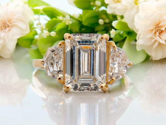 14k yellow gold engagement ring with 3.10 ctw emerald cut lab diamond and .90 ctw side stones, IGI VS2 F