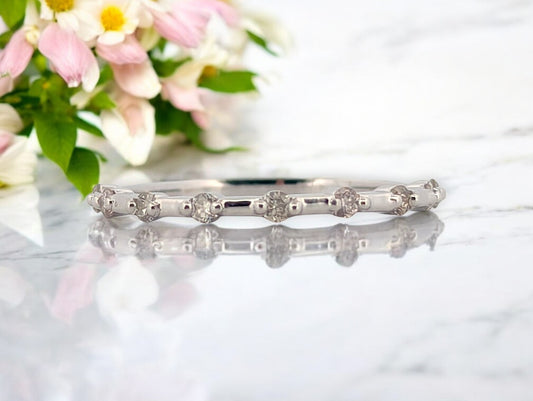 10k white gold band ring with .20 carat total weight natural diamonds