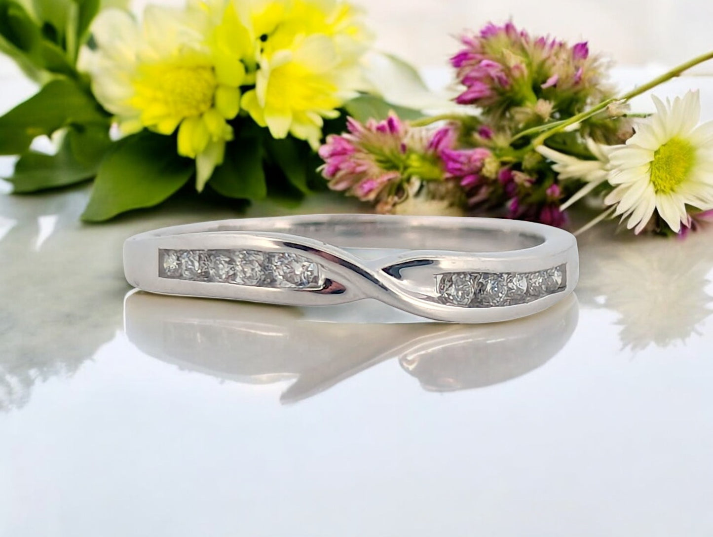 10k white gold band with .18 ctw bezel set natural diamonds