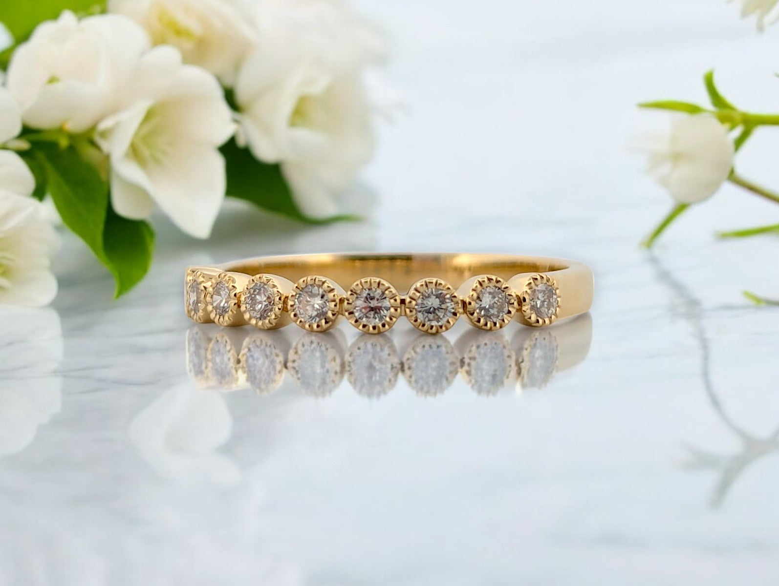 10k yellow gold band with .22 ctw natural diamonds and vintage milgrain detail