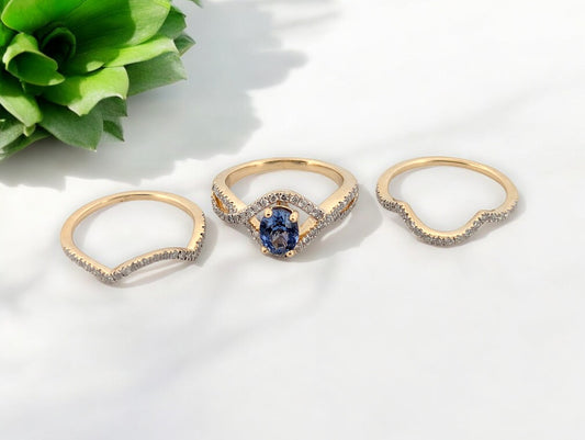 14k yellow gold wedding set with .70 carat oval tanzanite and .70 carat total weight natural round diamonds, contour bands