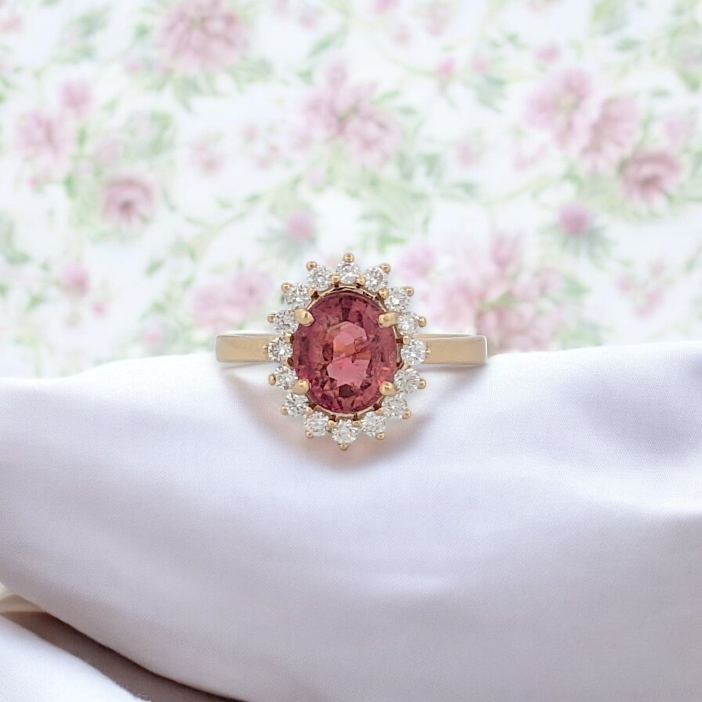 14k yellow gold ring with peach tourmaline center stone and .35 carat total weight natural diamonds