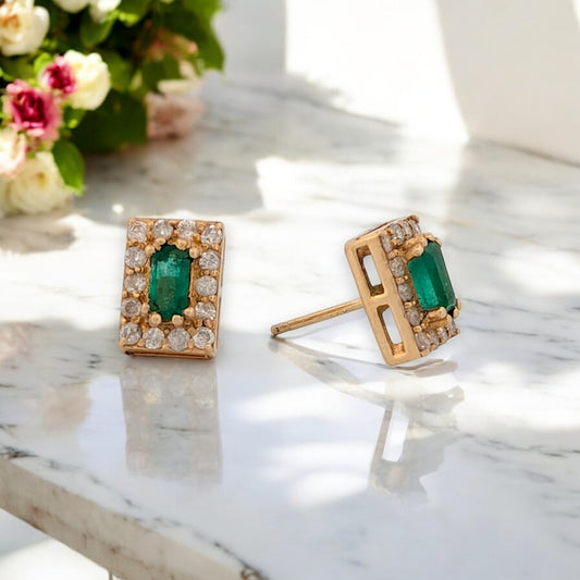 14k yellow gold post earrings with .95 ct emerald cut emeralds and .60 ctw natural diamonds