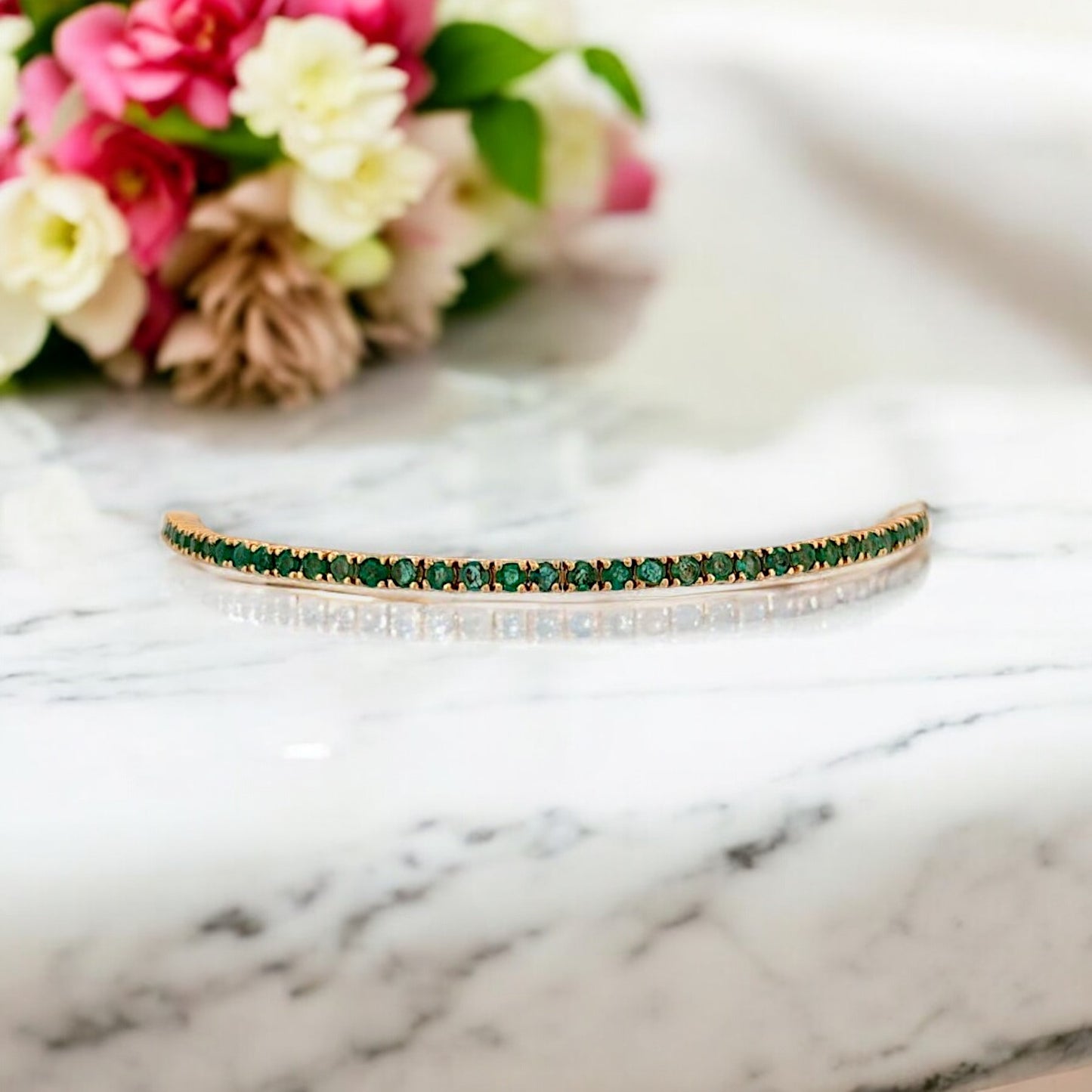 14k yellow gold tennis bracelet with 2.5 ct natural round emeralds